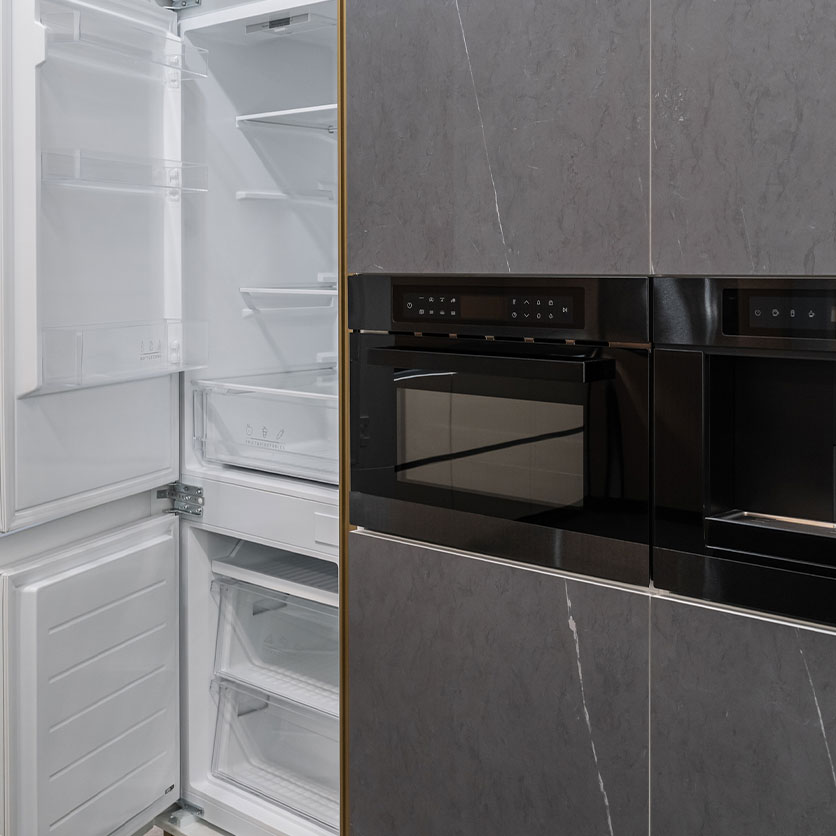 Built-in refrigerator and oven as part of the cabinetry for a cohesive look