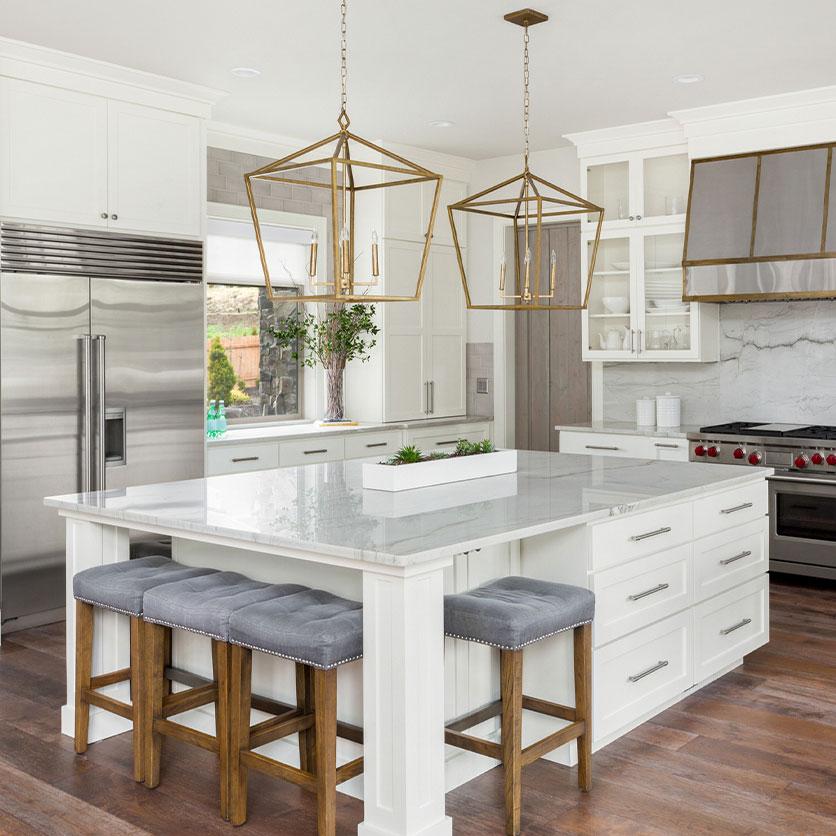 Luxury Kitchen with large central island customized to fit seating from multiple sides